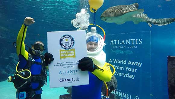 Dubai radio hosts achieves longest underwater live radio broadcast in Atlantis, The Palm aquarium