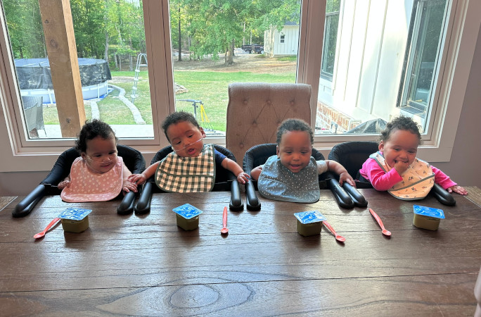 The Bryant quads eating dinner at their table