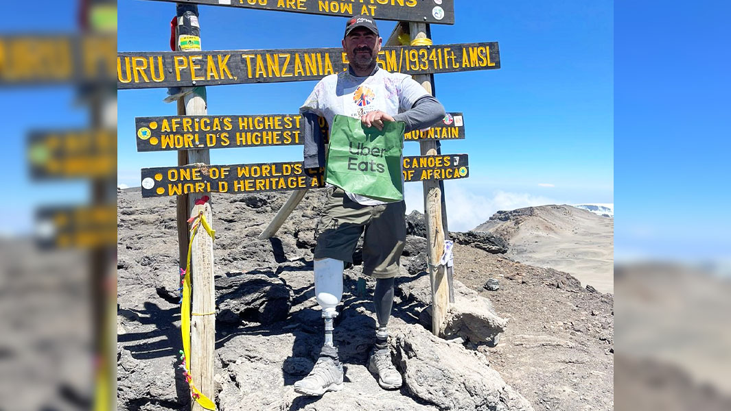 Triple amputee climbs Kilimanjaro for world’s highest burger delivery