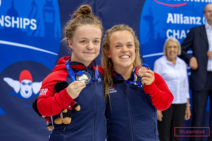 Ellie with Maisie Summers Newton showing medals