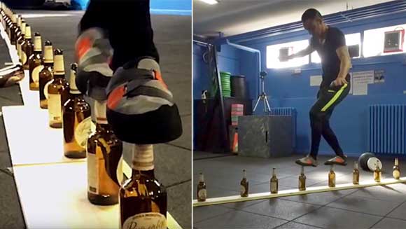 Video: Italian attempts to walk 10 metres on glass bottles for world record 