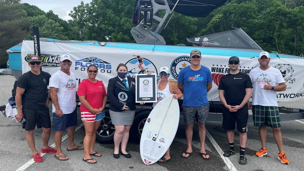 Indiana athlete shatters world record after surfing for eight hours 