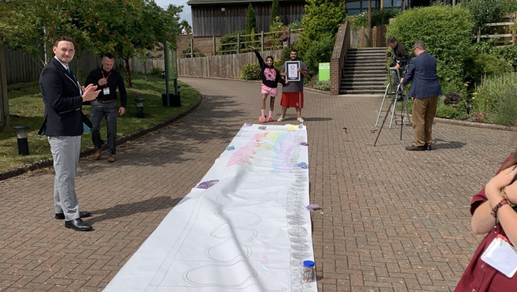 Katie Price's son Harvey sets world record with longest train drawing EVER