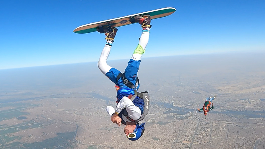 Daredevil breaks skysurfing helicopter spins world record