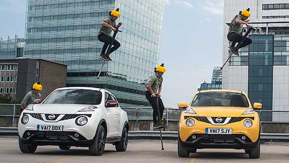 Video: Extreme pogo performer bounces over three Nissan cars for world record