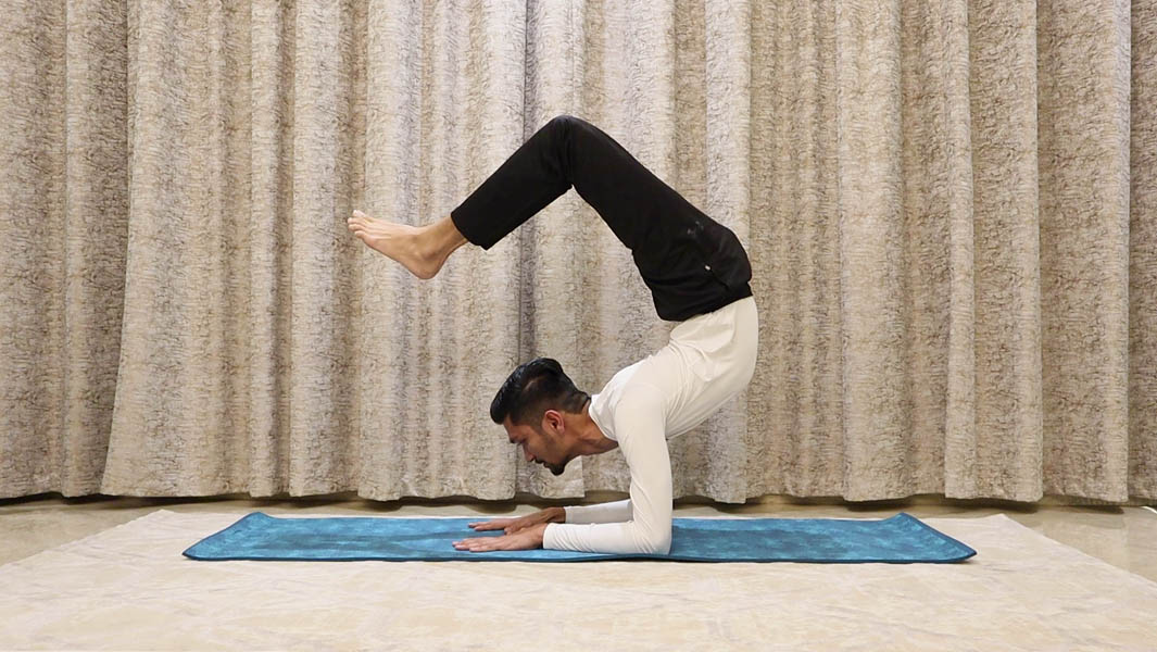Yoga teacher holds scorpion pose for 29 minutes to break record