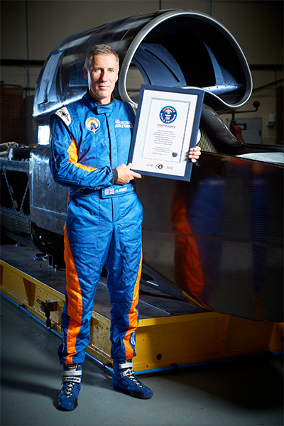 andy-green-with-his-guinness-world-records-certificate-and-thrust-ssc