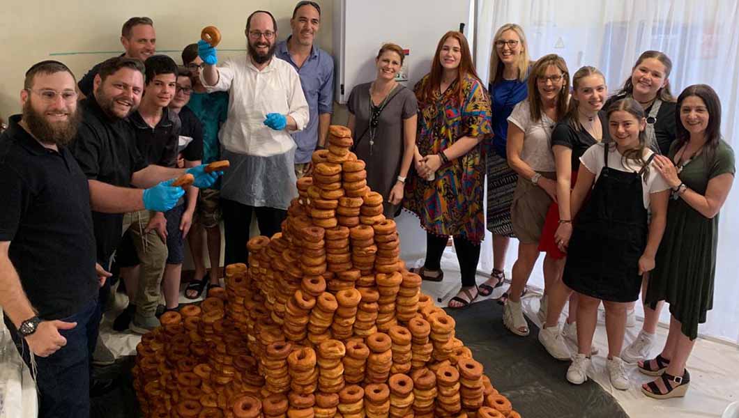 Sweet taste of success as more than 3,000 doughnuts are stacked to form record-breaking tower