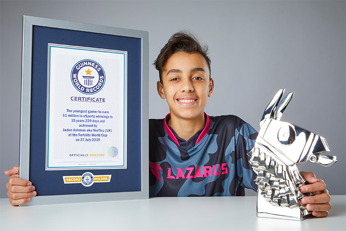 jaden-ashman-with-his-fortnite-world-cup-runners-up-trophy-and-guinness-world-records-certificate