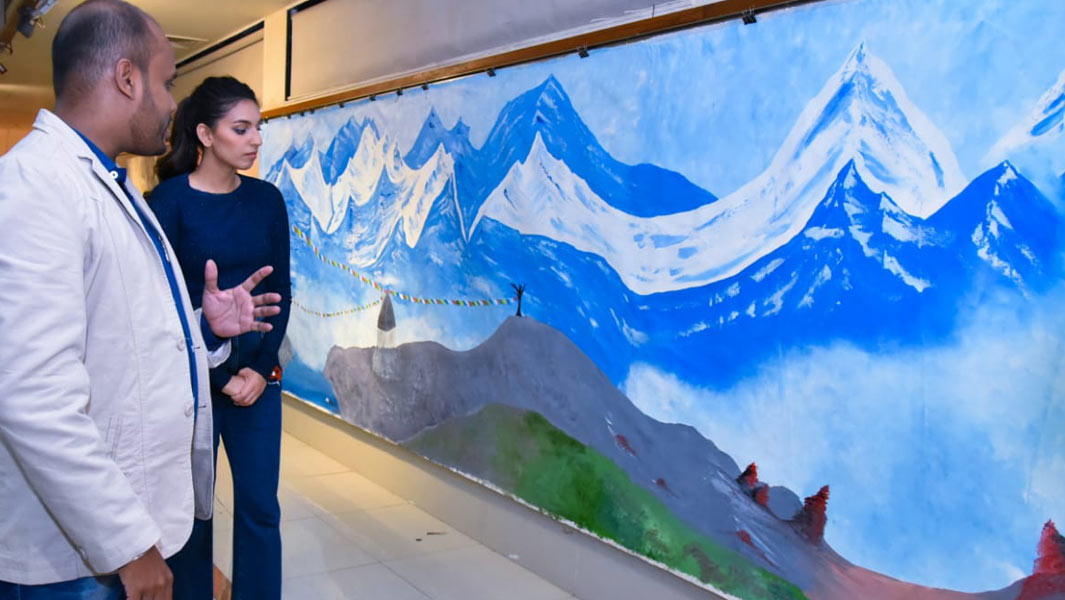 Artist dedicates world's largest oil painting to victims of acid attacks