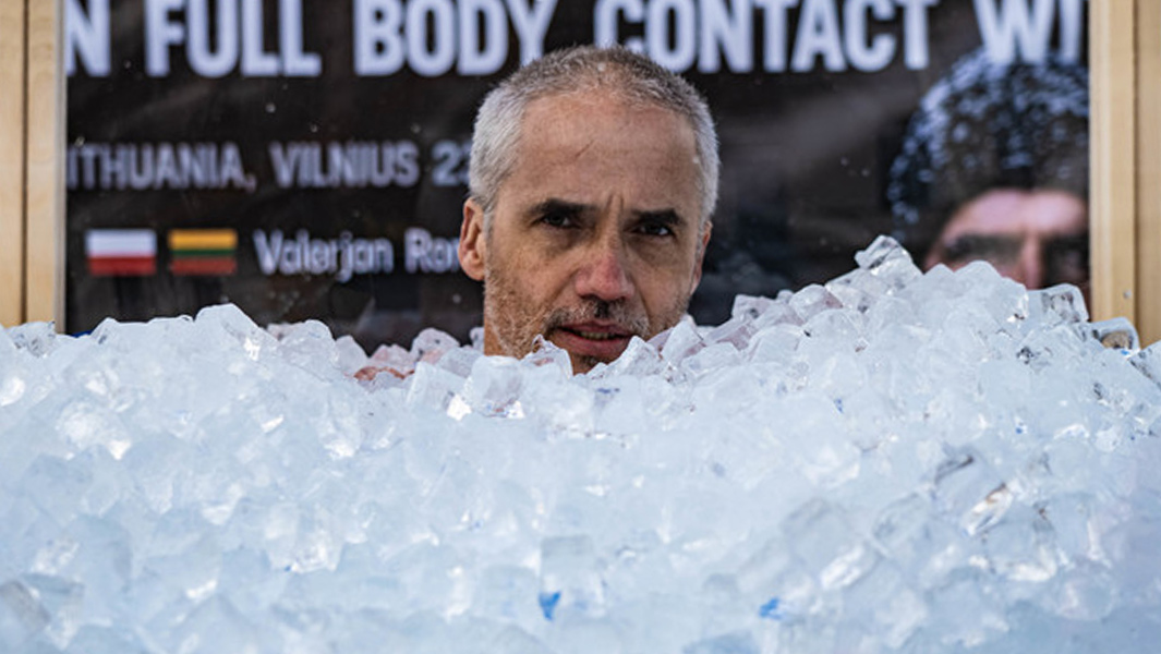 Man spends three hours in full body contact with ice to break record