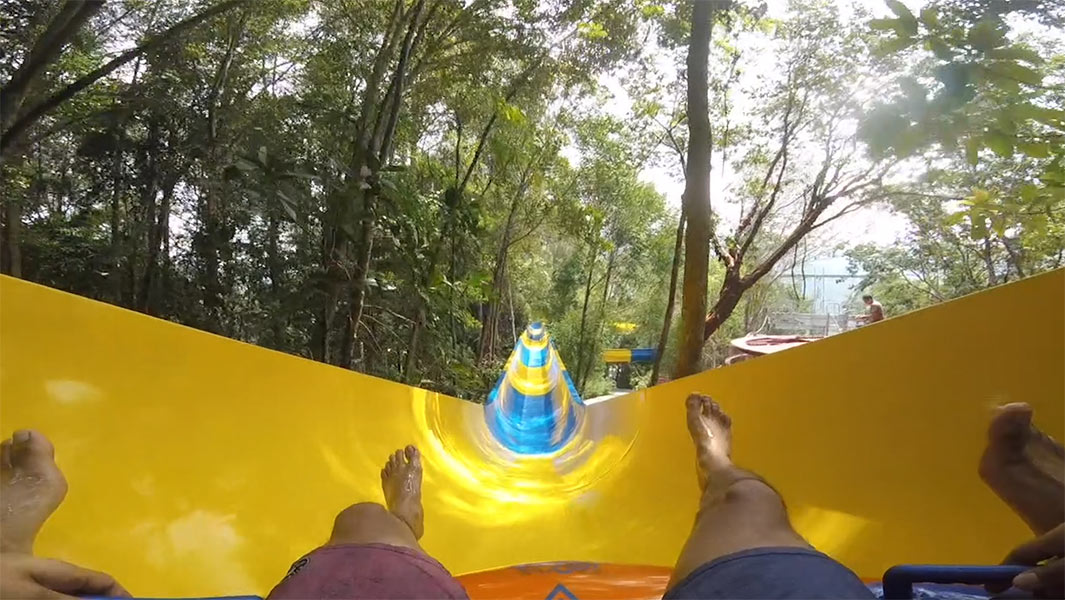 Ride through the trees on the world’s longest mat water slide – all 1,111 m of it