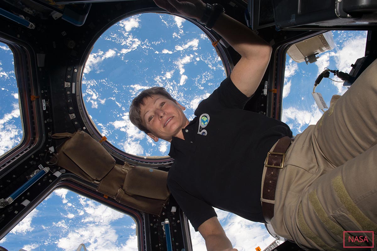 Peggy Whitson in the Cupola module of the International Space Station, looking down on Earth