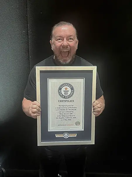 Ricky with certificate smiling