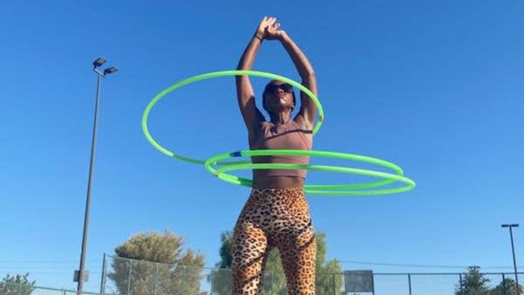Watch this skating superstar roller skate and hula hoop backwards