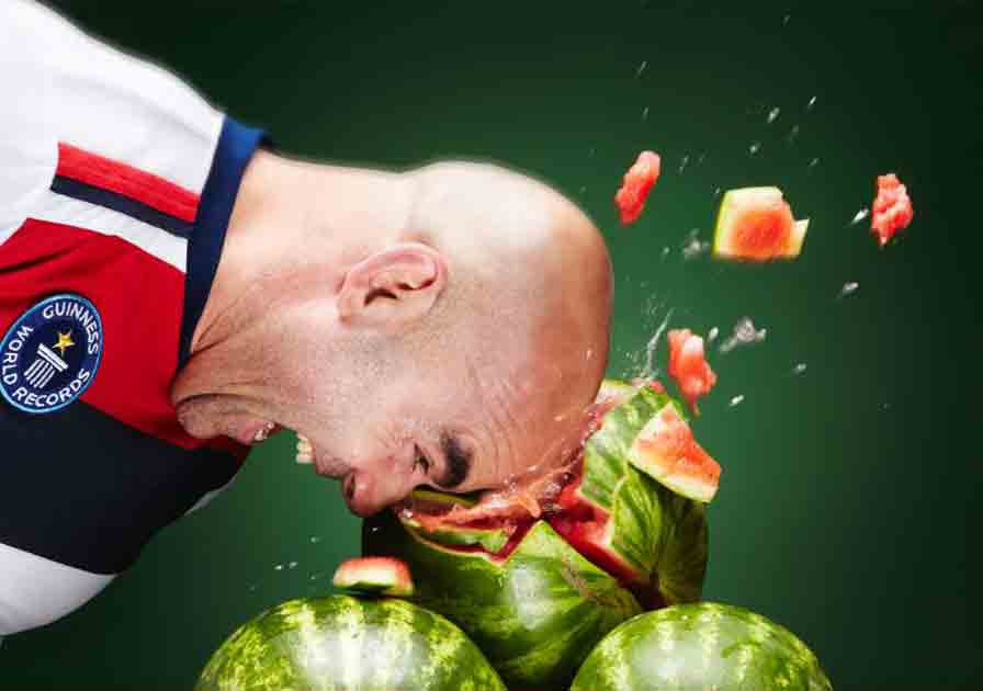 Man crushing watermelon with his head