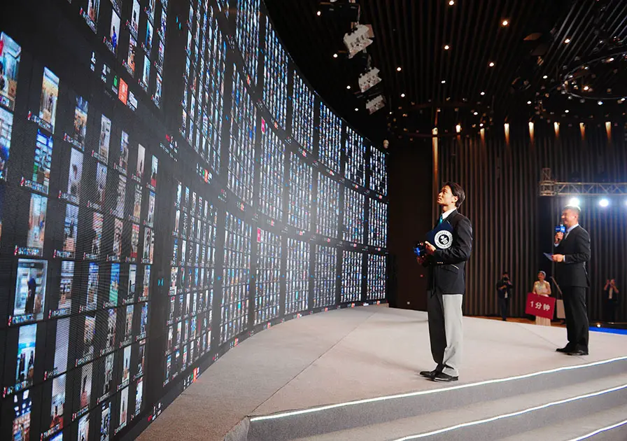 adjudicator looking at a huge screen