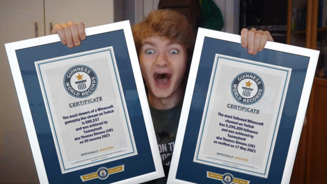 TommyInnit with his two Guinness World Records certificates