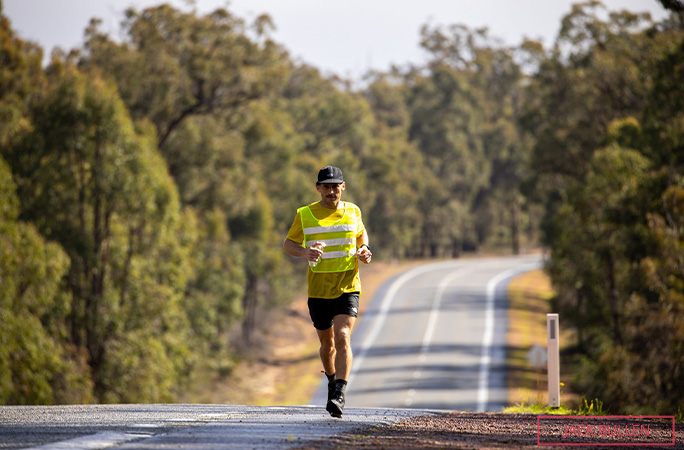 Chris is running down the road