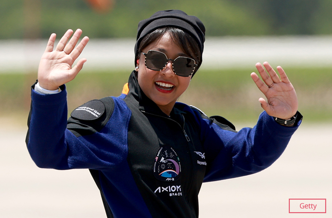 Rayyanah Barnawi waving to the cameras