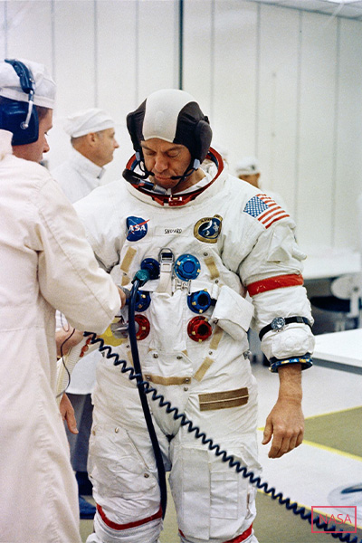 Alan Shepard being suited up for Apollo 14