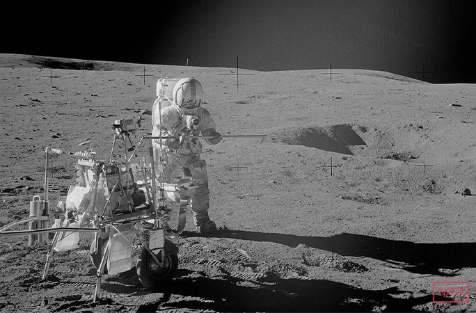 Alan Shepard holding his makeshift golf club