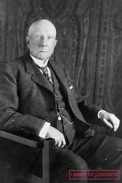 Rockefeller sitting in a chair