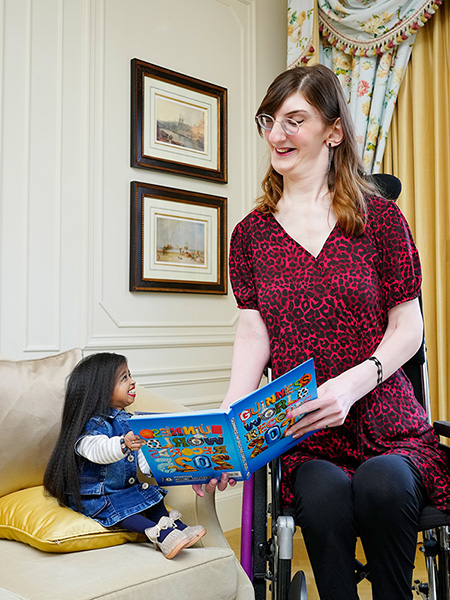 Rumeysa and Jyoti looking at the book