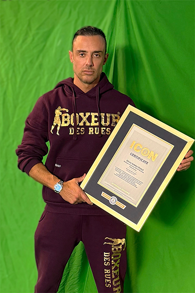 Silvio with green background and ICON certificate