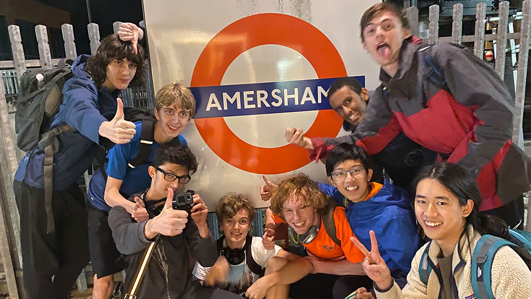 Group in front of Amersham station sign