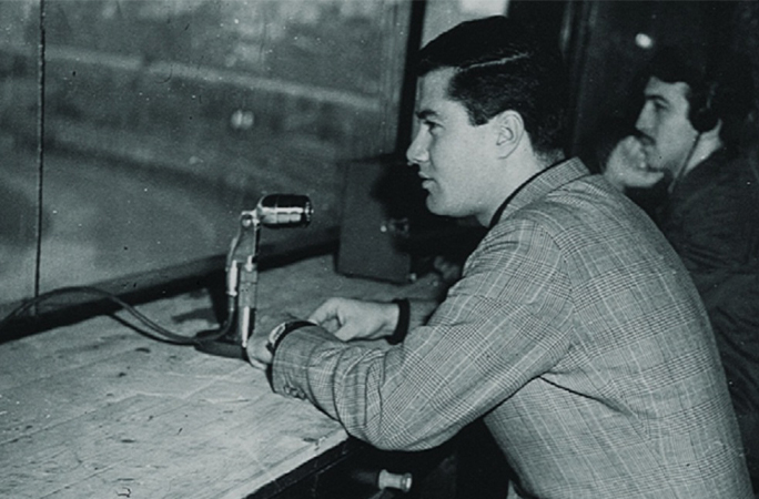 Orhan commentating a football match