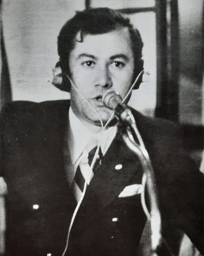 Black and white photo of Orhan commentating