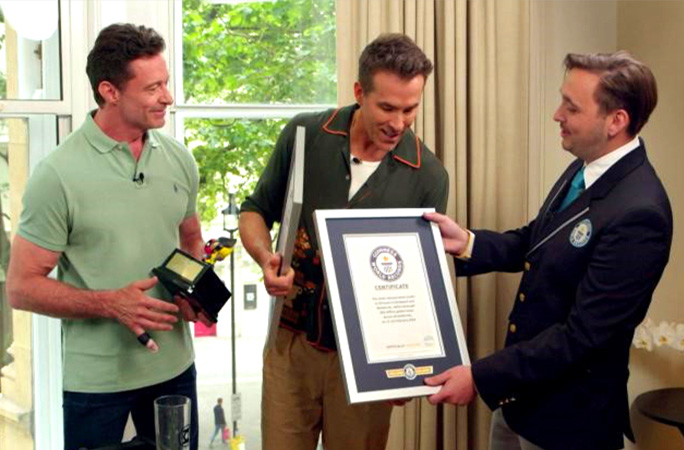 Ryan Reynolds and Hugh Jackman with GWR certificates