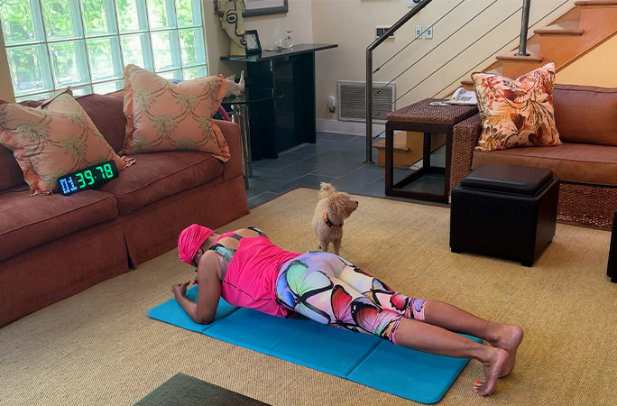 Annie planking with a clock timing her