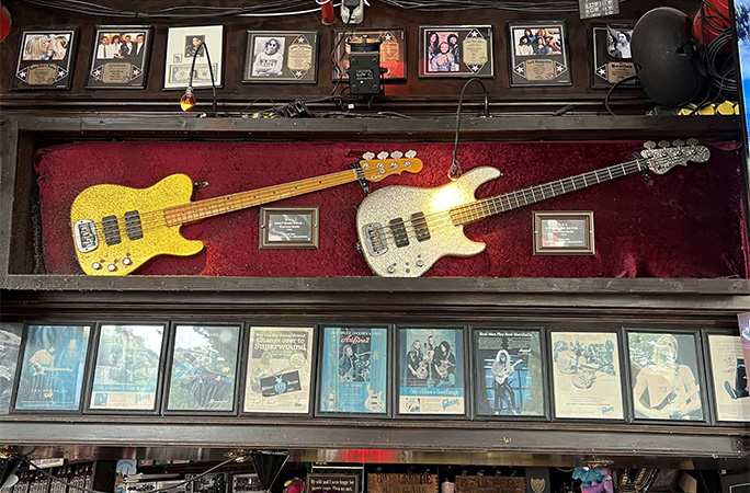Bass guitar collection on display