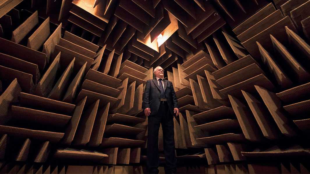 Man standing inside an anechoic chamber