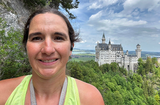 Selfie of Kristen with castle in background
