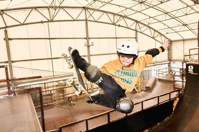 Ema doing skateboard tricks