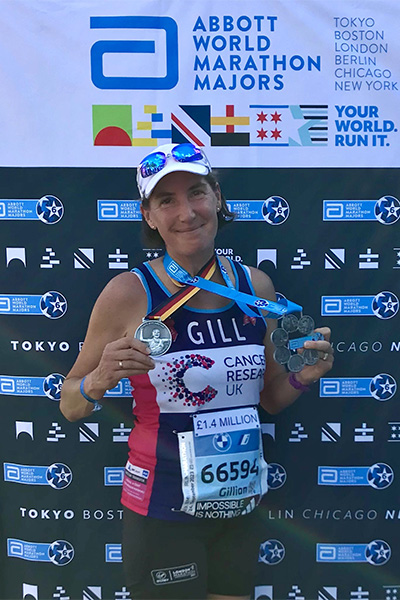 Gill posing with some of her medals