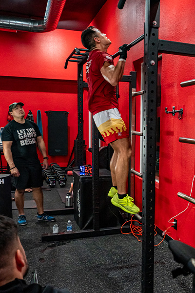 Tommy being watched while doing burpee pull ups