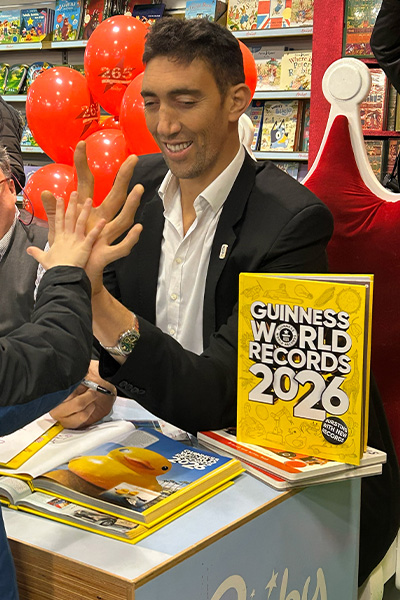 a child comparing their hand to Sultan's