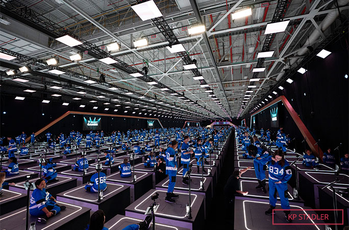 Beast Games contestants on pillars