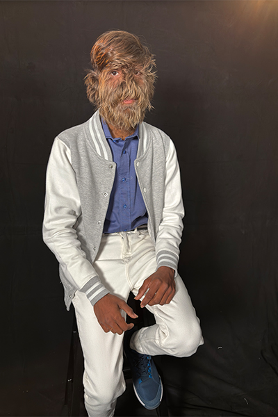 Lalit sitting on a stool