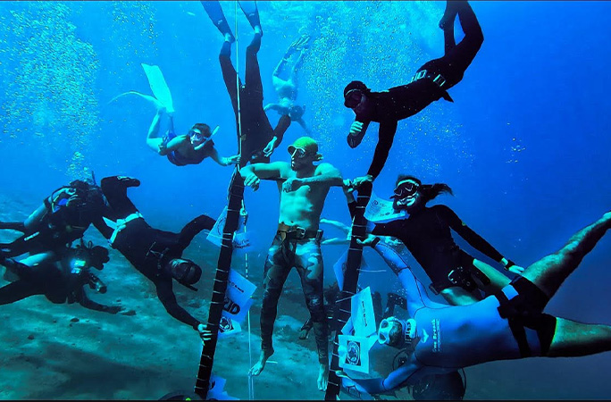 Ramy with a crowd of people watching him