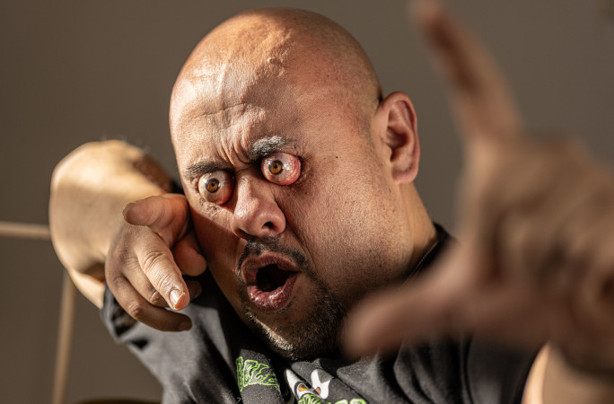 William stretching his arms and eyes