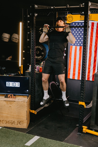 Close up of Truett doing pull ups