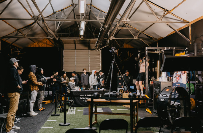 Spectators watching Truett do his pull ups