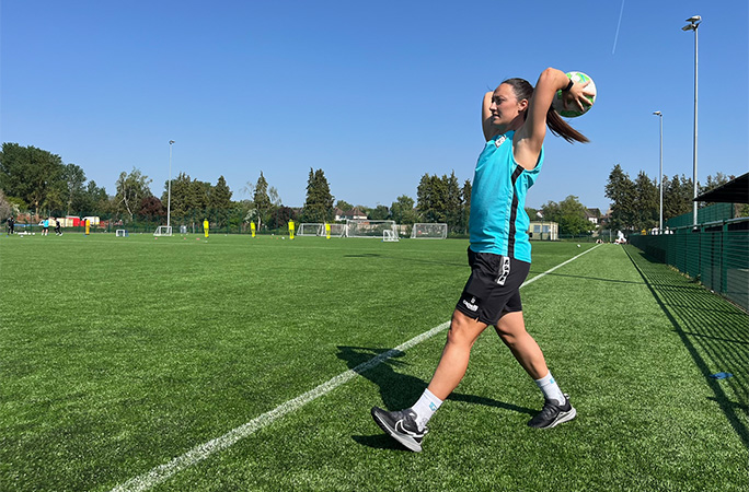 Megan with the ball behind her head