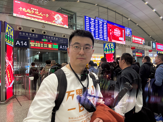 wangdong-standing-infront-of-the-Shenzhen-north-station
