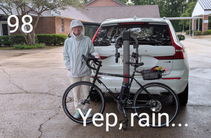 Bob's wife Kathryn in front of their car